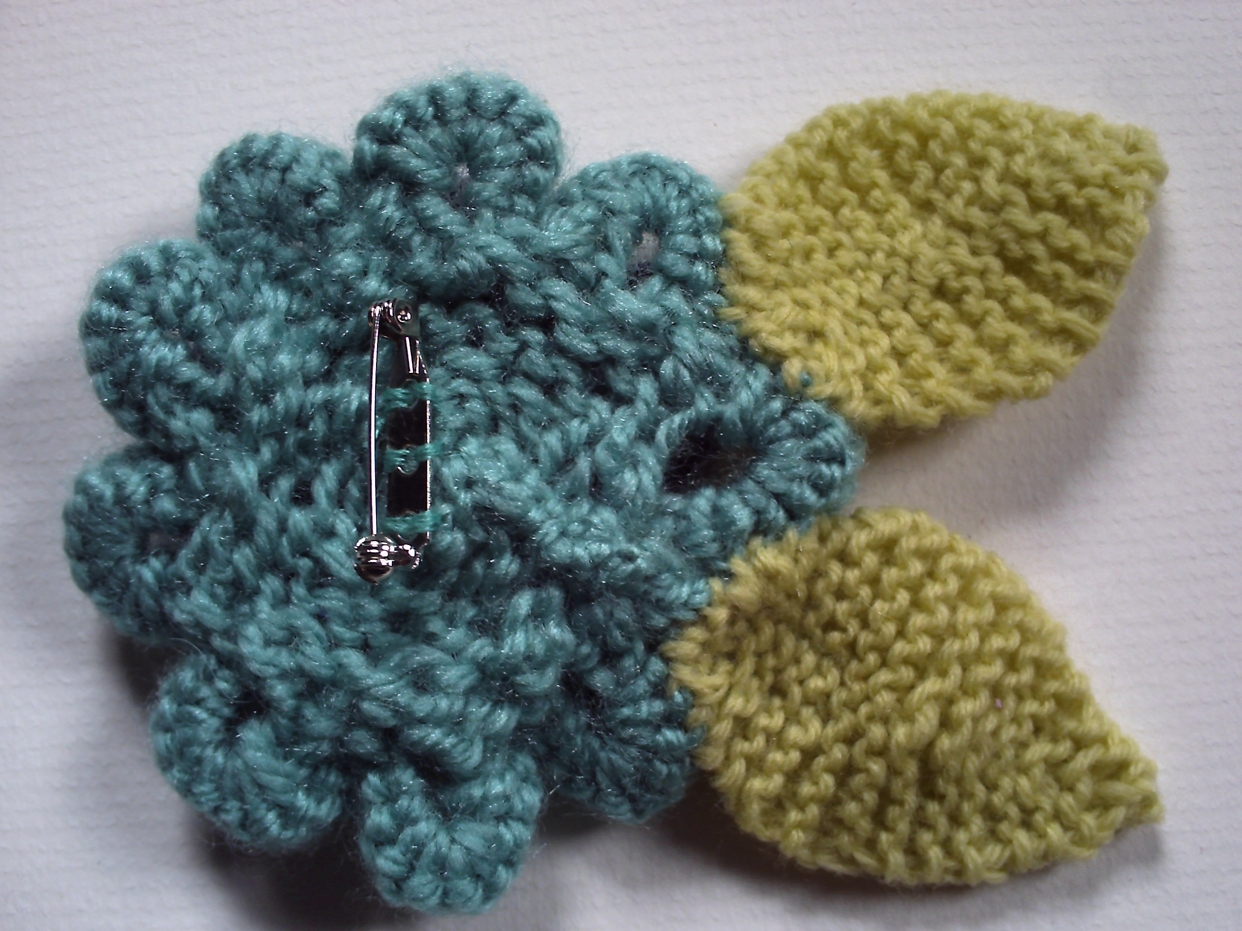 OOAK hand knitted flower brooch pin. Turquoise and navy blue. on Storenvy
