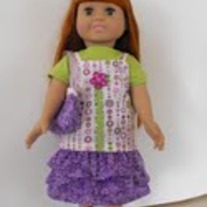 Green tshirt, purple and green camisole, purple ruffle skirt, purse